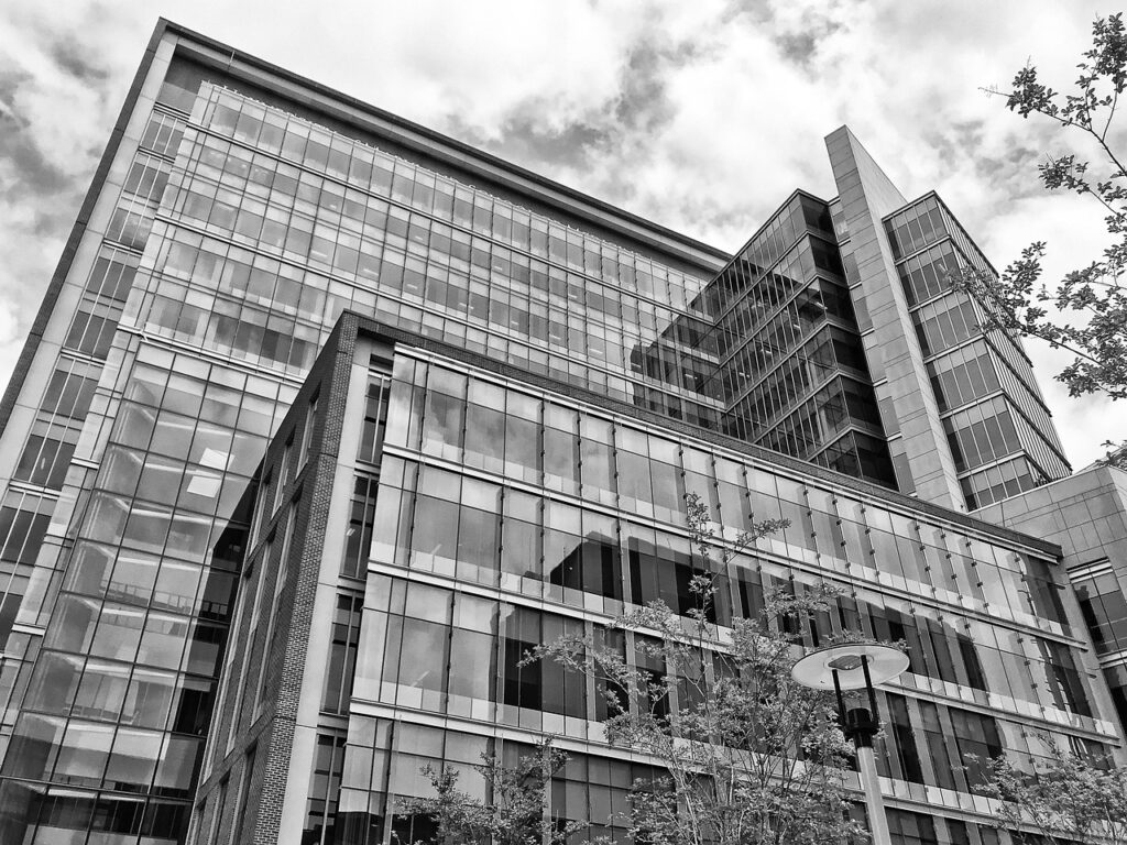 Glass office buildings in Baltimore, photographed in black and white from street level